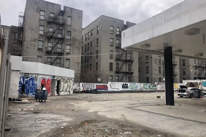 Lot on West 145th Street in Harlem, between Adam Clayton Powell Jr. Boulevard and Lenox Avenue, where a builder plans a truck depot after first proposing new housing, including affordable units.